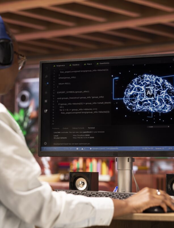 Artificial Intelligence Developer Female developer wearing headphones, doing checkup on AI systems