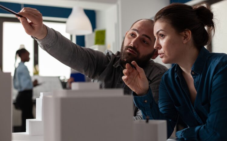 Developers looking towards a computer screen.