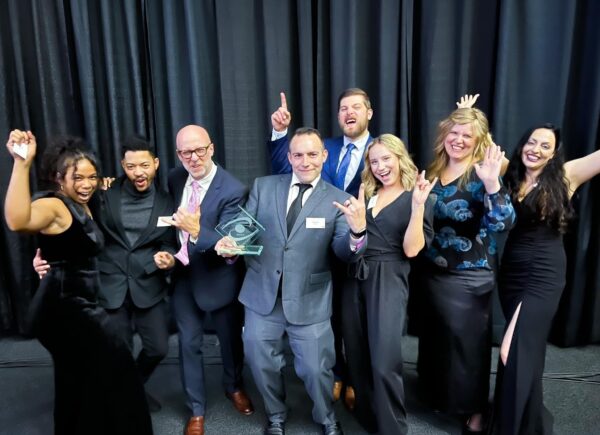 Team Cynerge posing for an award