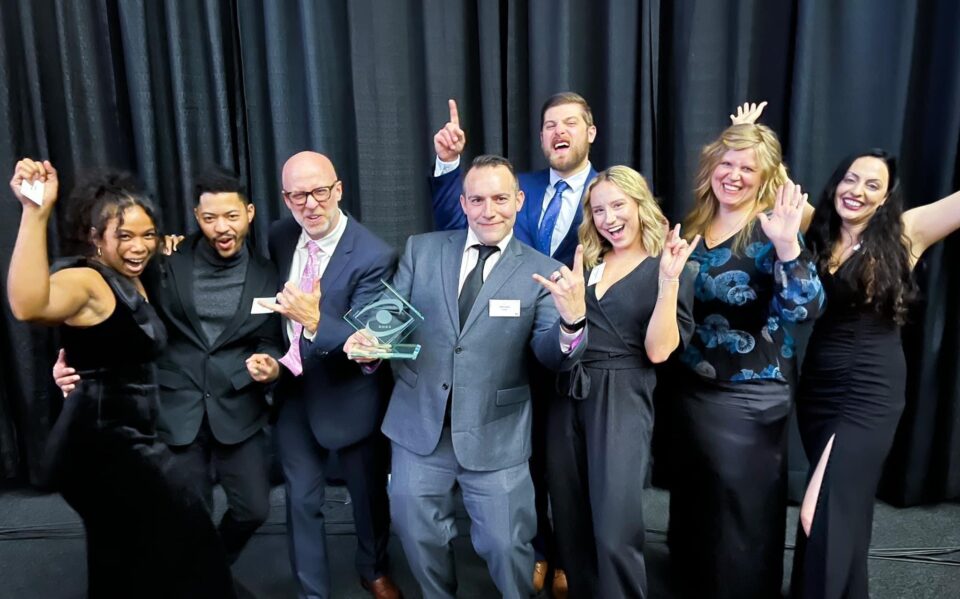 Team Cynerge posing for an award