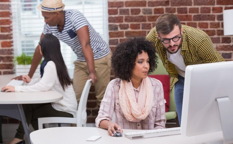 Developers sitting at desks looking at their computer screens.
