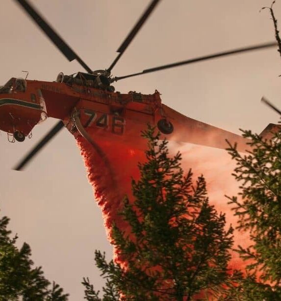 Heavy helicopter drops fire retardant on the Happy Camp Complex Fire in the Klamath National Forest in California, which began on Sep. 17, 2014 from lightening and has consumed 125, 788 acres to date and is 68% contained. U.S. Forest Service photo by Kari Greer.
