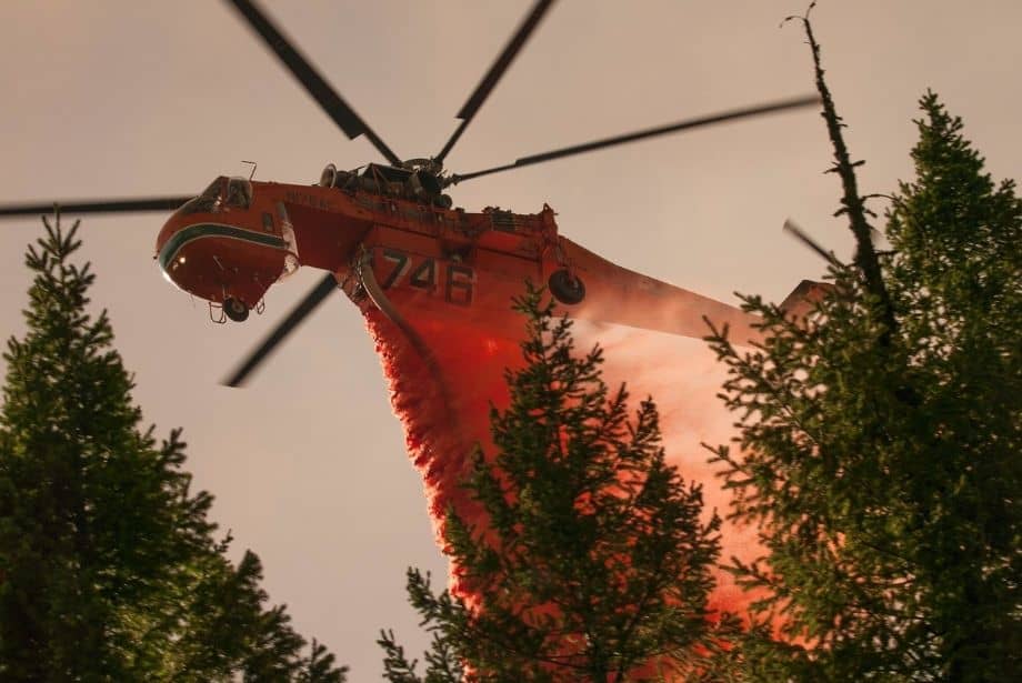 Heavy helicopter drops fire retardant on the Happy Camp Complex Fire in the Klamath National Forest in California, which began on Sep. 17, 2014 from lightening and has consumed 125, 788 acres to date and is 68% contained. U.S. Forest Service photo by Kari Greer.
