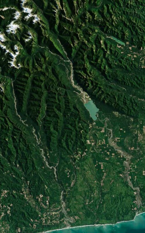 Satellite imagery of federally managed forest and mountain terrain, illustrating the scale and complexity of public land management