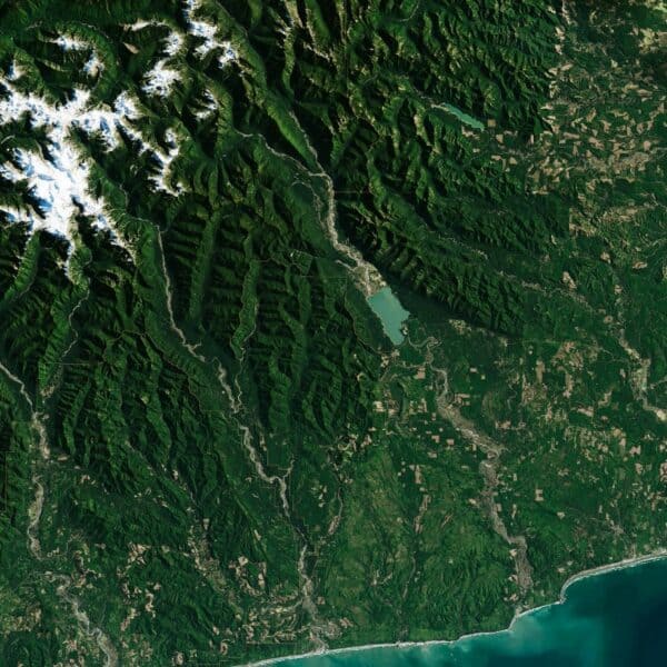 Satellite imagery of federally managed forest and mountain terrain, illustrating the scale and complexity of public land management