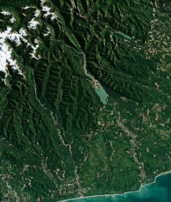Satellite imagery of federally managed forest and mountain terrain, illustrating the scale and complexity of public land management