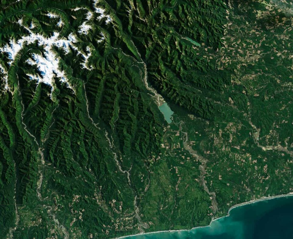 Satellite imagery of federally managed forest and mountain terrain, illustrating the scale and complexity of public land management